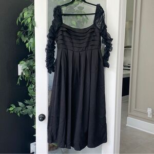 Black dress with ruffle long sleeves and lace details